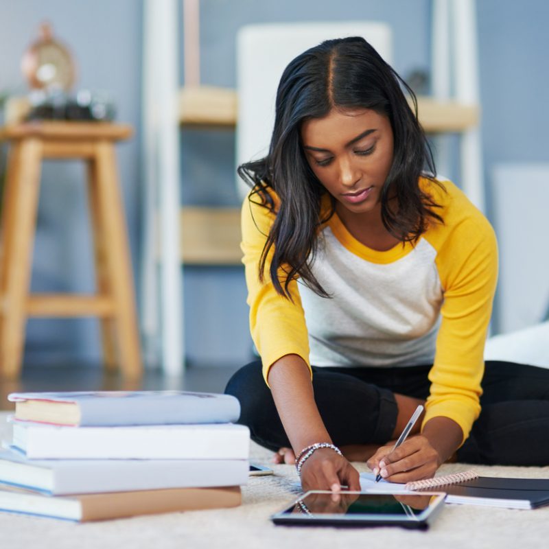 student-using-tablet-studying