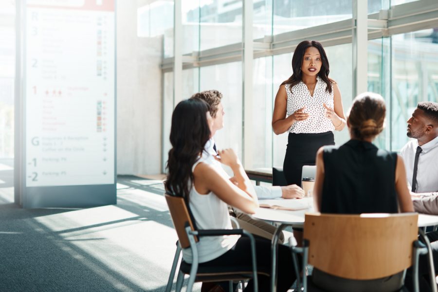 Businesspeople having a meeting to maintain positive communication between the team.