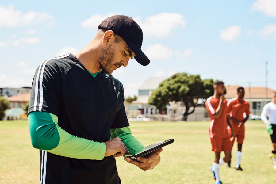 soccer-coach-using-tablet